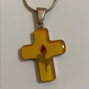 Silver cross with real rose inside